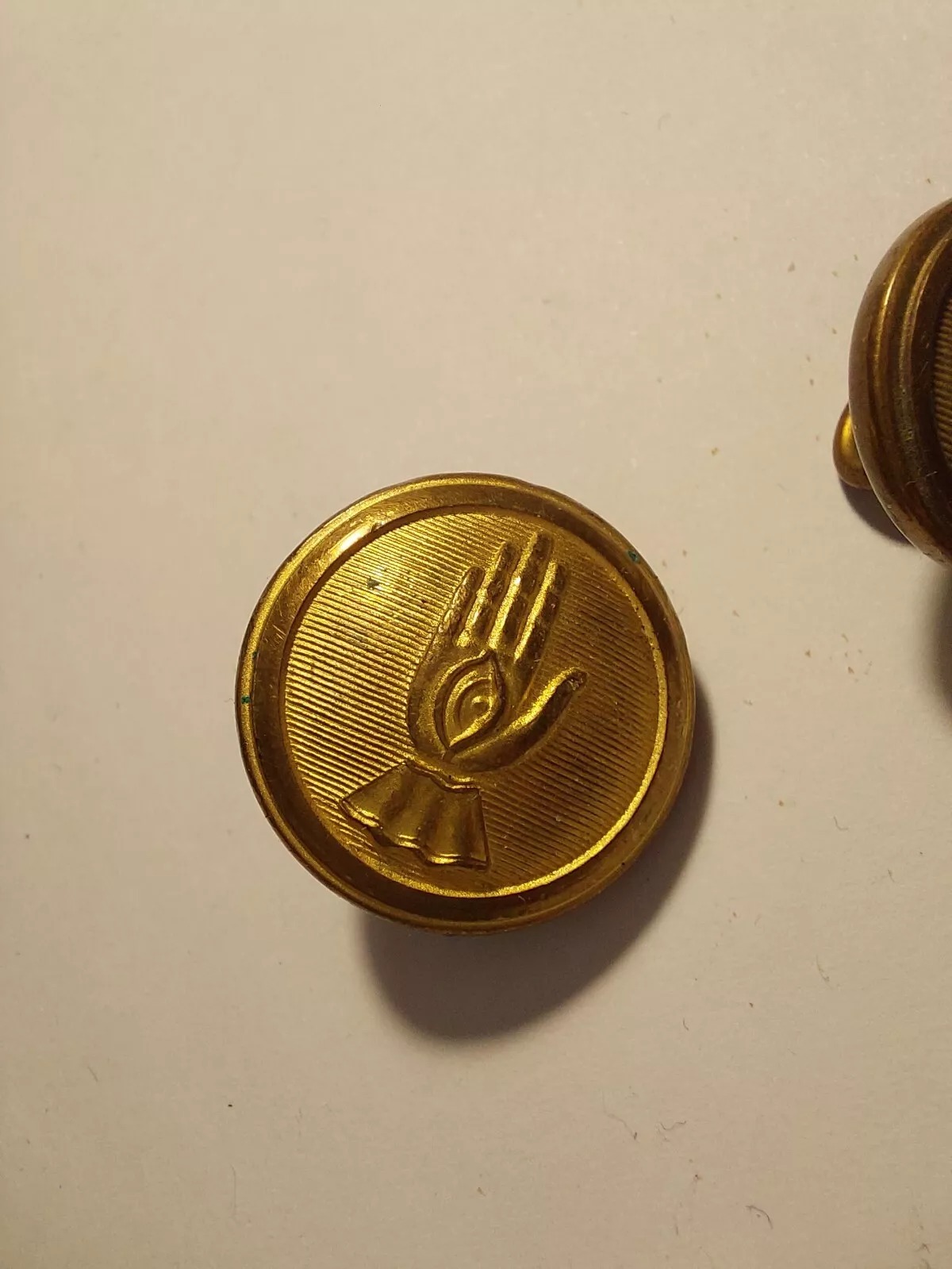 Pair of Vintage Icelandic Police Uniform Buttons – Gold-Plated Brass with Hand Motif - Image 2